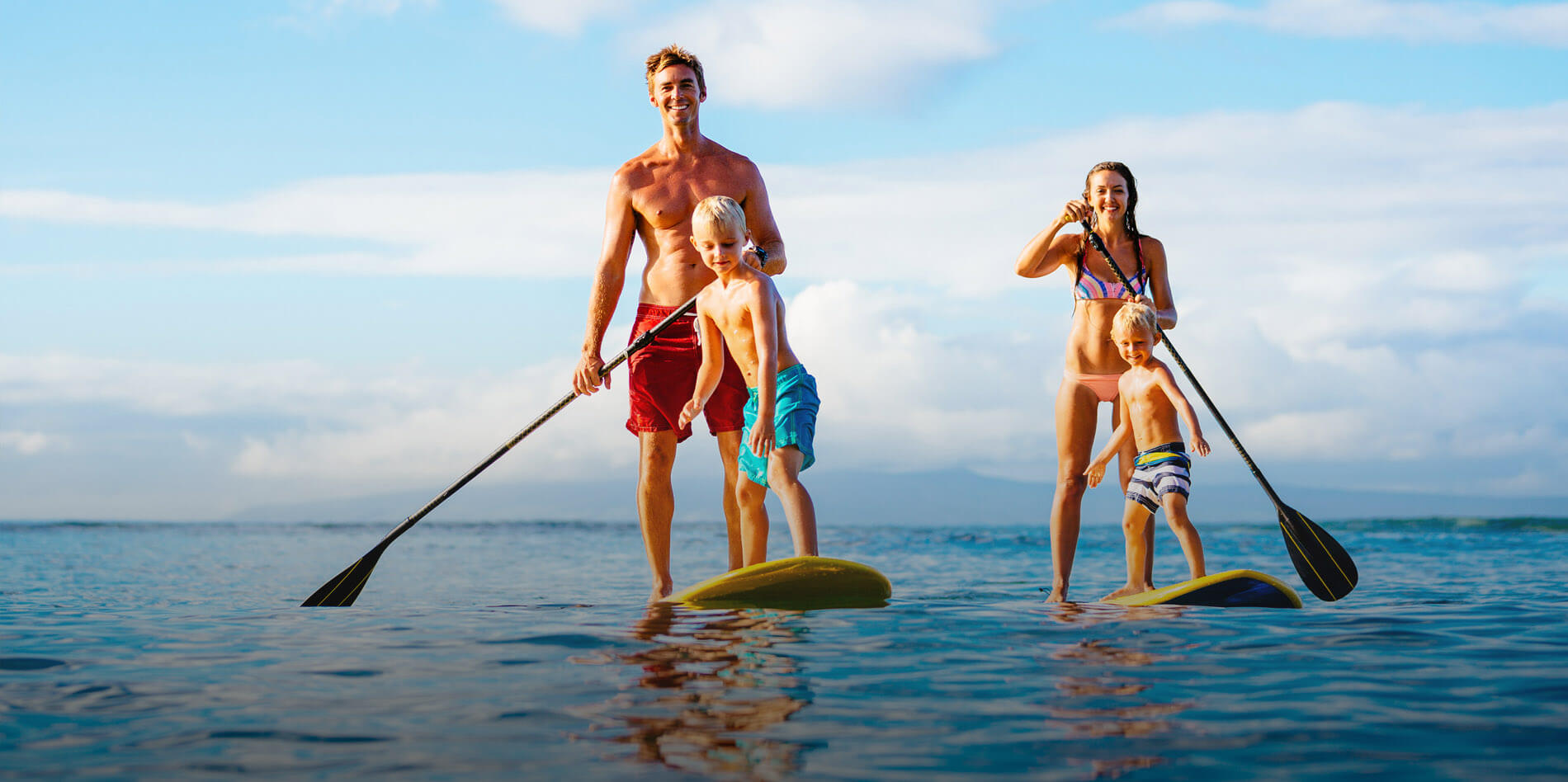 Family on stand-up paddleboards