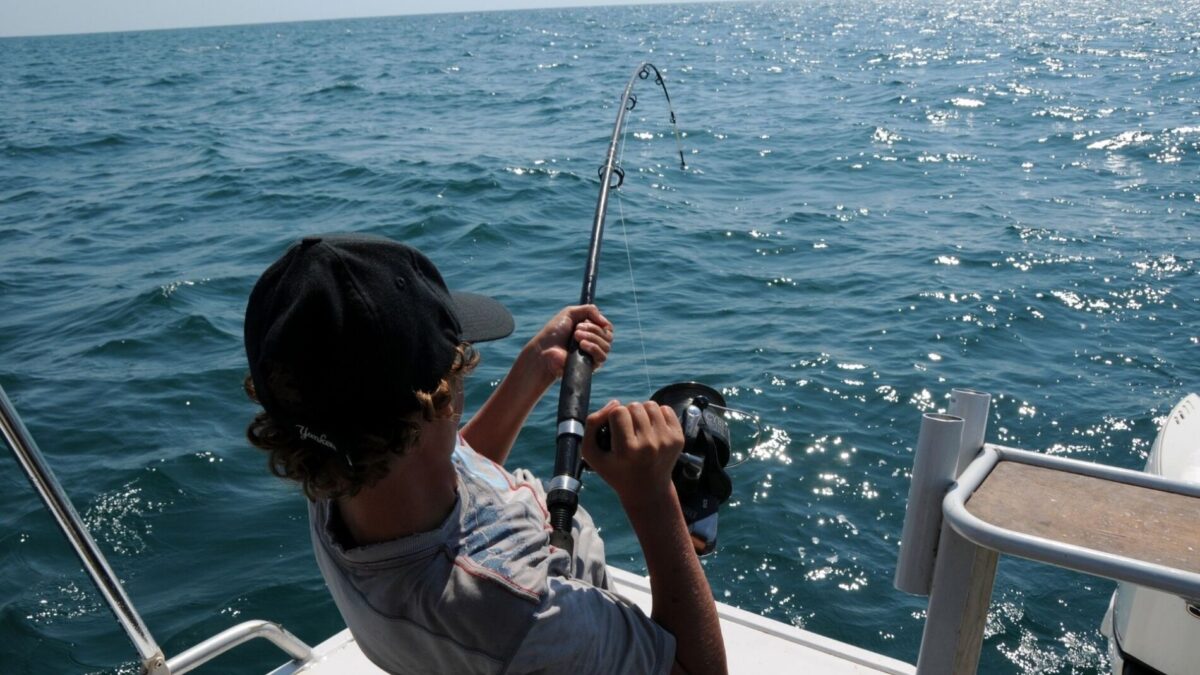 man fishing on an Atlantic Beach fishing charter