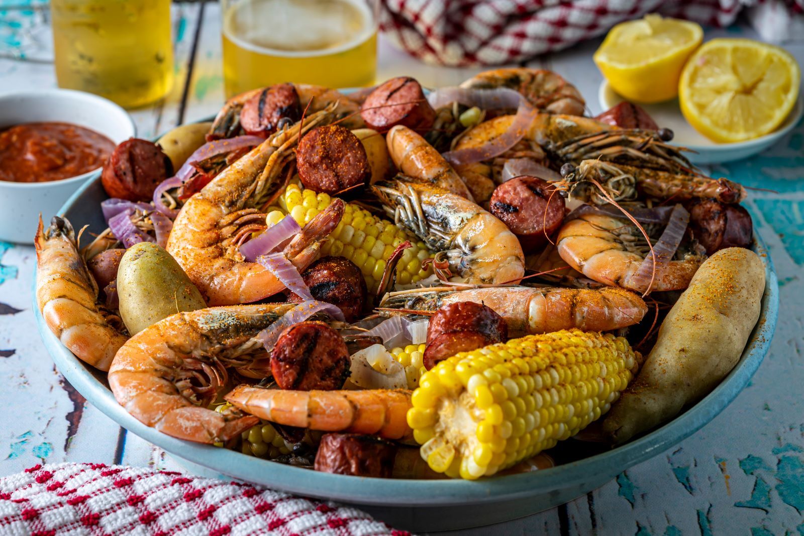 plate of potatoes, shrimp, corn, and more